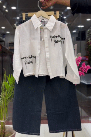 Classic White Cropped Button-Down Shirt with Black Script Embroidery Paired with Dark Blue Wide-Leg Denim Culottes 👔🤍👖✨